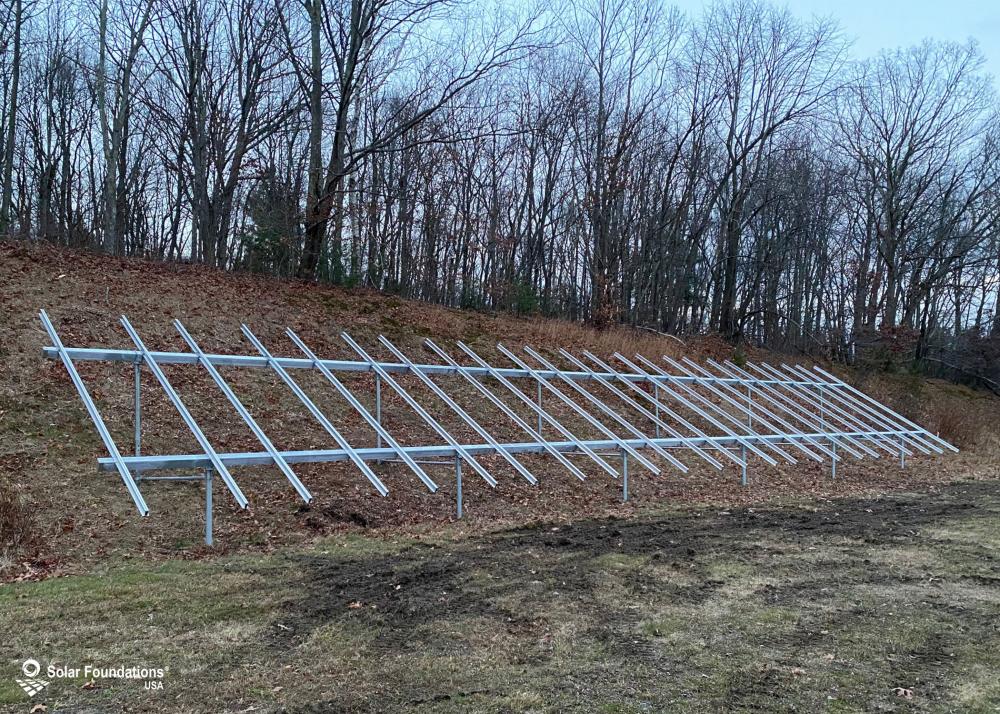 24 kW Ground Mount System in Torrington, CT. This featured system is built for 5 panels high in landscape by 12 panel columns wide.