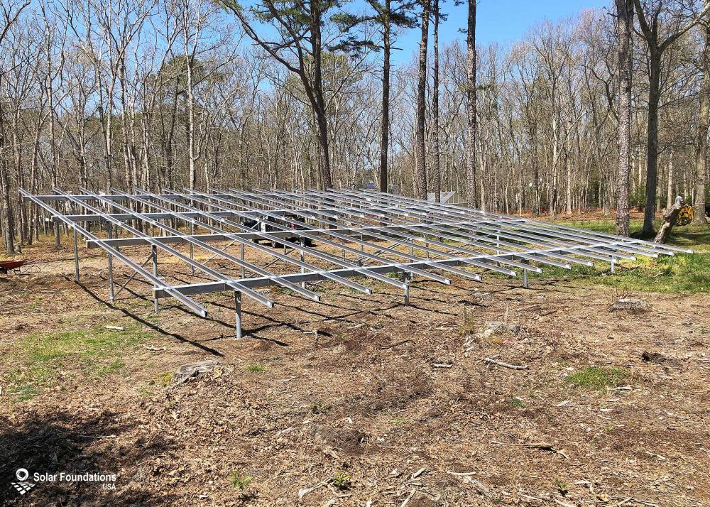 32.76 kW Ground Mount System in Galloway, NJ. This featured system is built for 13 panels high in landscape by 8 panel columns wide.