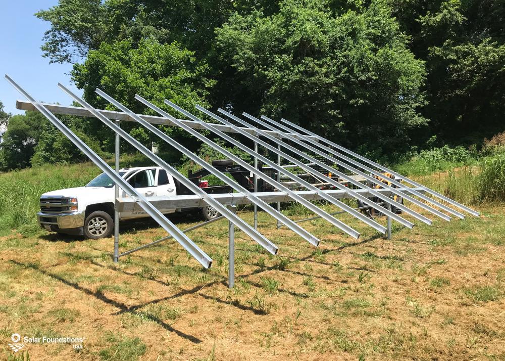 8.55 kW Ground Mount System in Churchville, MD. This featured system is built for 6 panels high in landscape by 5 panel columns wide.