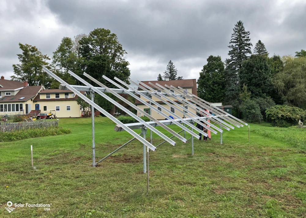 8.64 kW Ground Mount System in Chesterfield, MA. This featured system is built for 4 panels high in landscape by 6 panel columns wide.