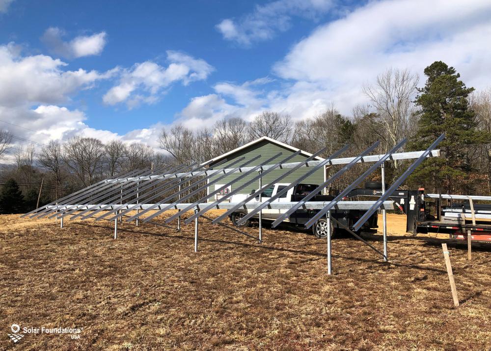 13.5 kW Ground Mount System in Alloway, NJ. This featured system is built for 5 panels high in landscape by 9 panel columns wide.