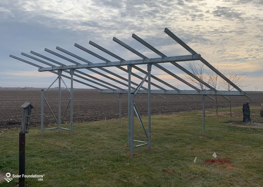 9.81 kW Ground Mount System in Kenney, IL. This featured system is built for 6 panels high in landscape by 5 panel columns wide.